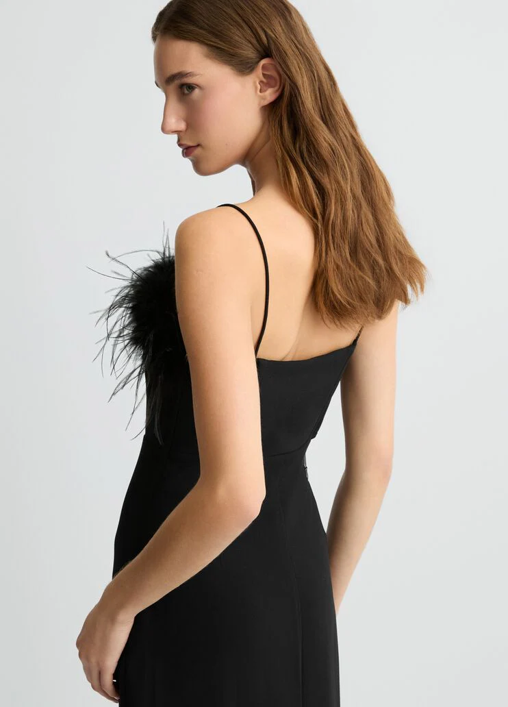 Elegant black dress with feathers