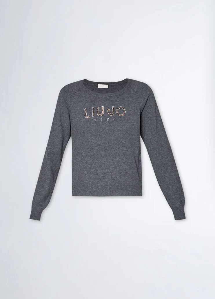 Top with logo and gemstones