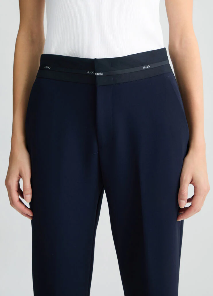 Trousers with branded waistband