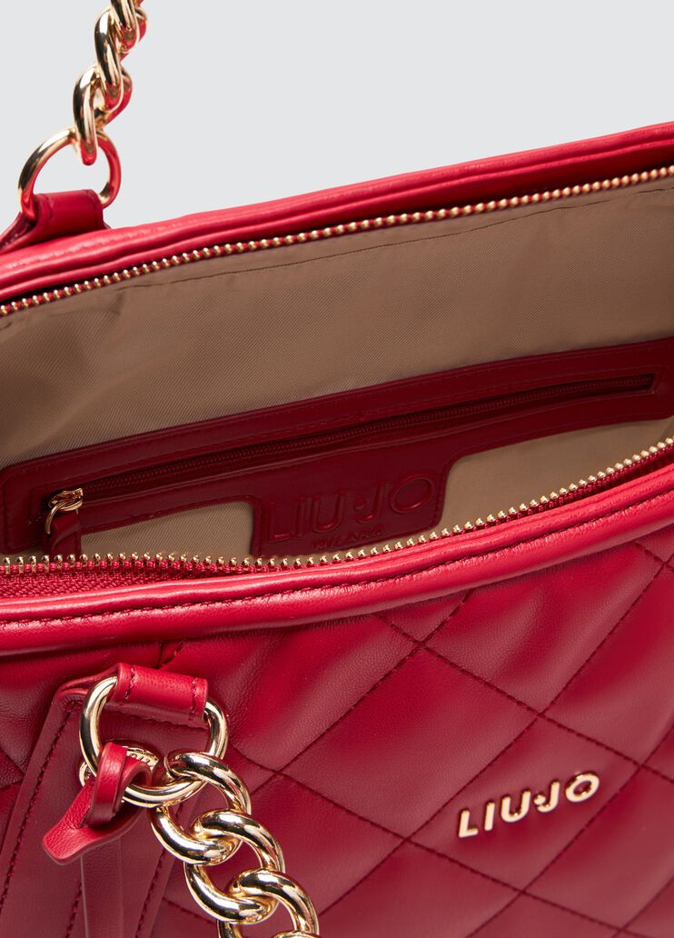 Quilted shopping tote with charm