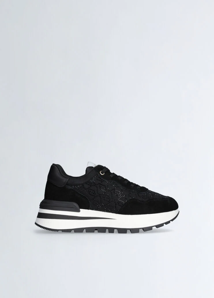 Black sneakers with rhinestone-detailed logo