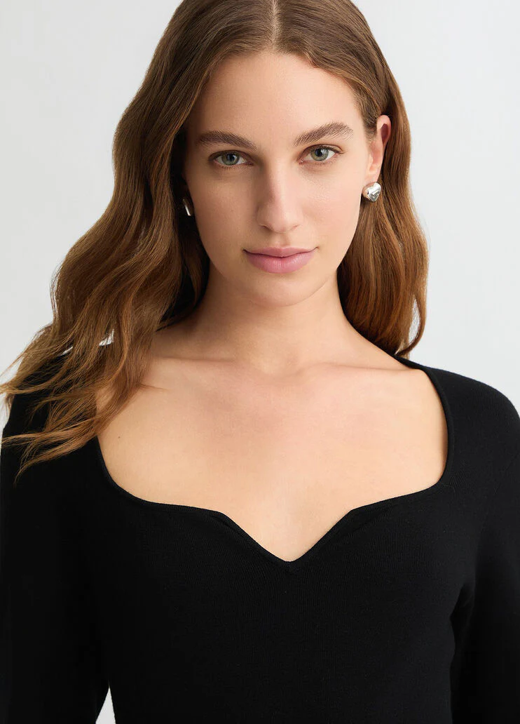 Short black dress with bejewelled embellishment