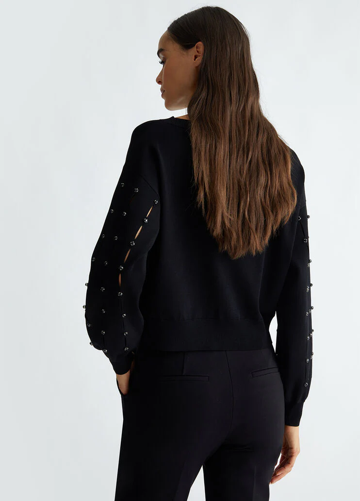 Cut-out sweater with rhinestones