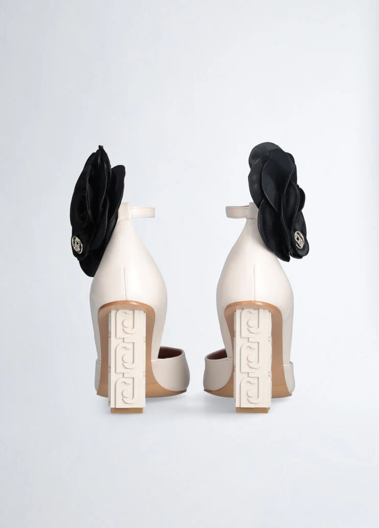 White court shoes with flower detail