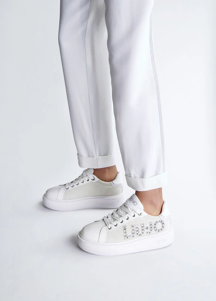 White sneakers with bejewelled logo
