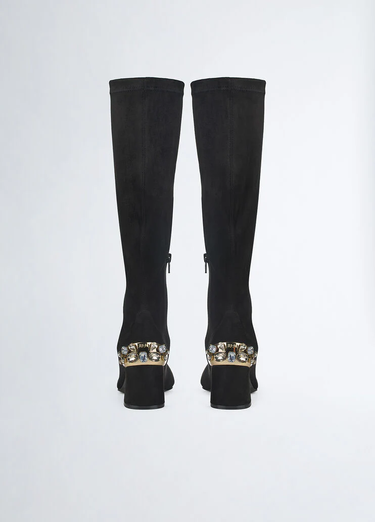 Knee-high boots with bejewelled gemstones