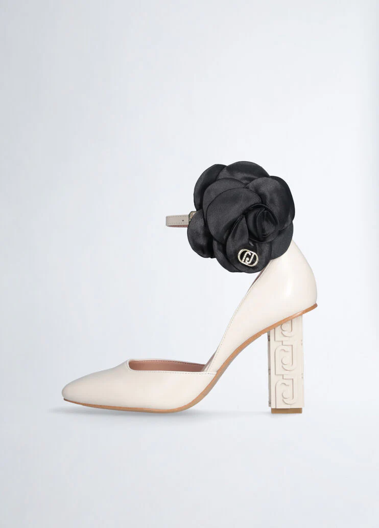 White court shoes with flower detail
