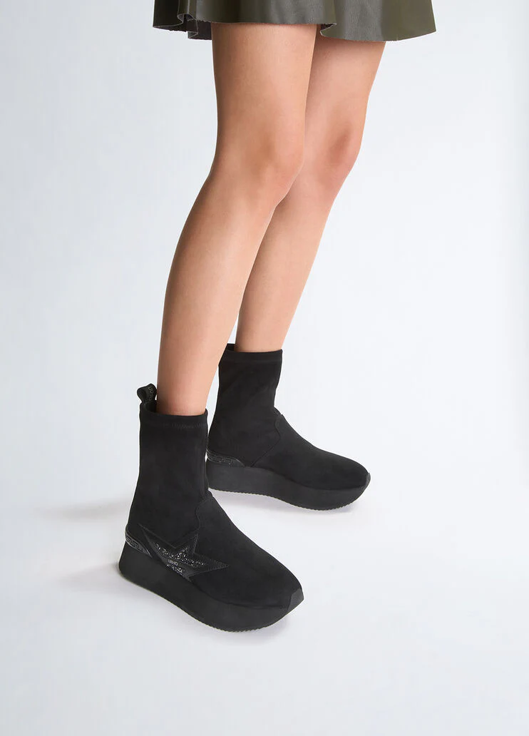 Black ankle boots with glittery star