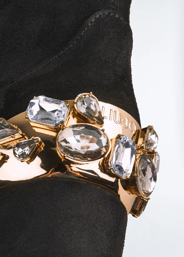 Knee-high boots with bejewelled gemstones