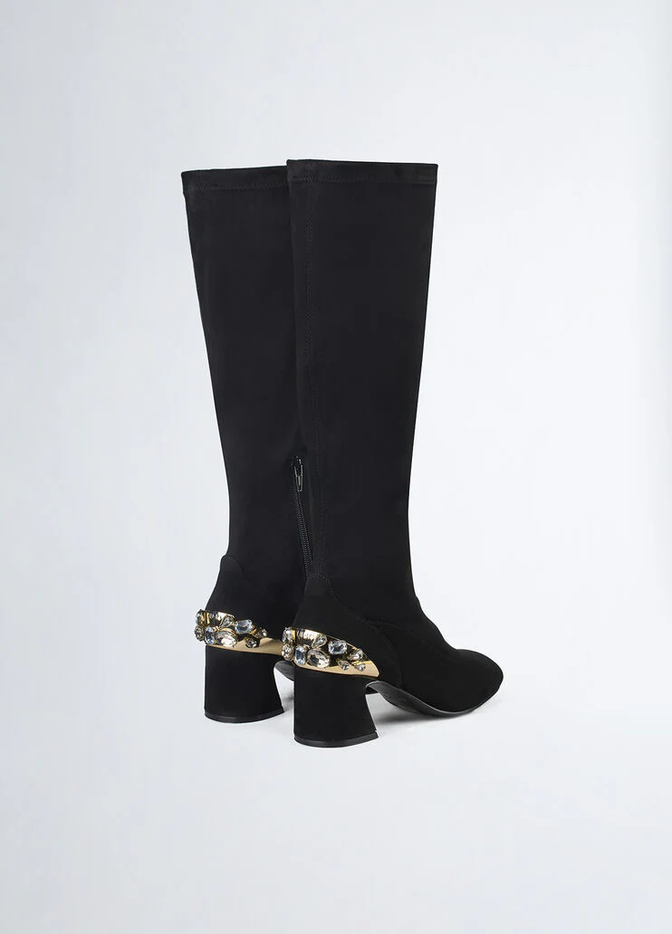 Knee-high boots with bejewelled gemstones