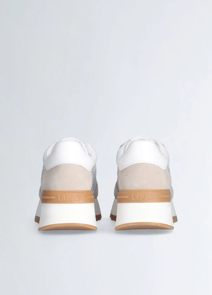 White sneakers with rhinestone-detailed logo