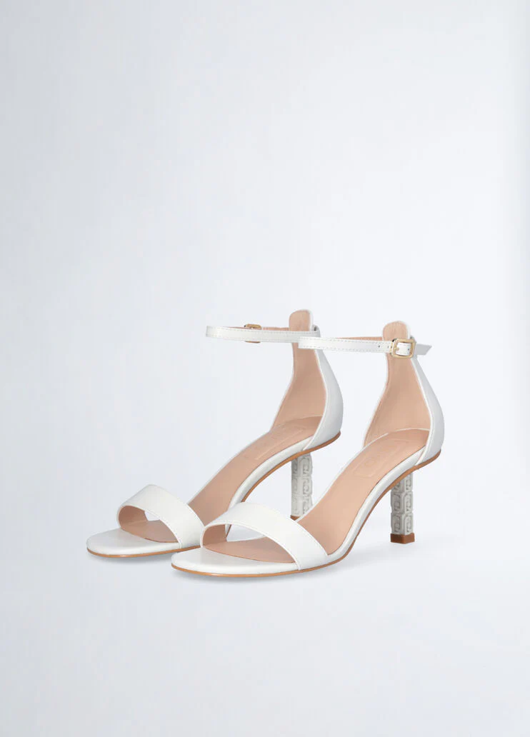 Sandals with branded heel