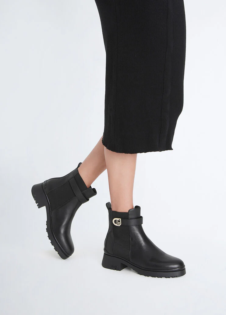 Black leather ankle boots with logo