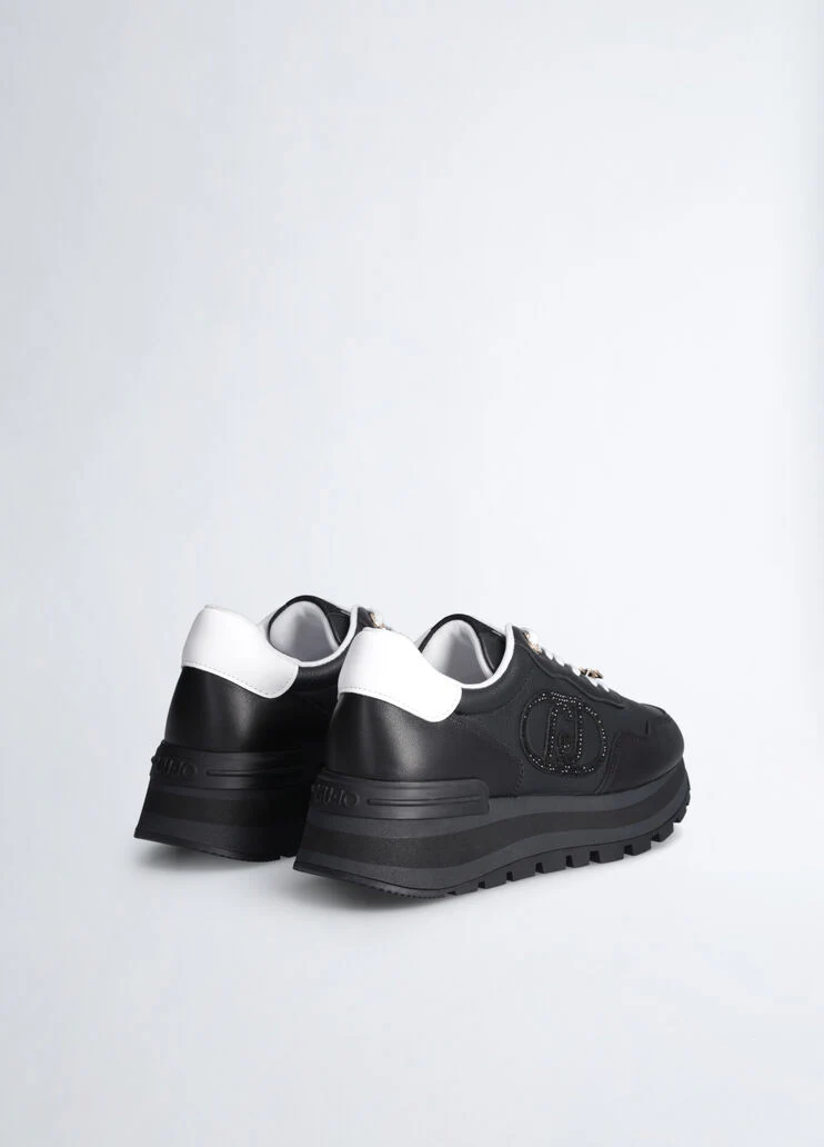 Black leather sneakers with bejewelled logo