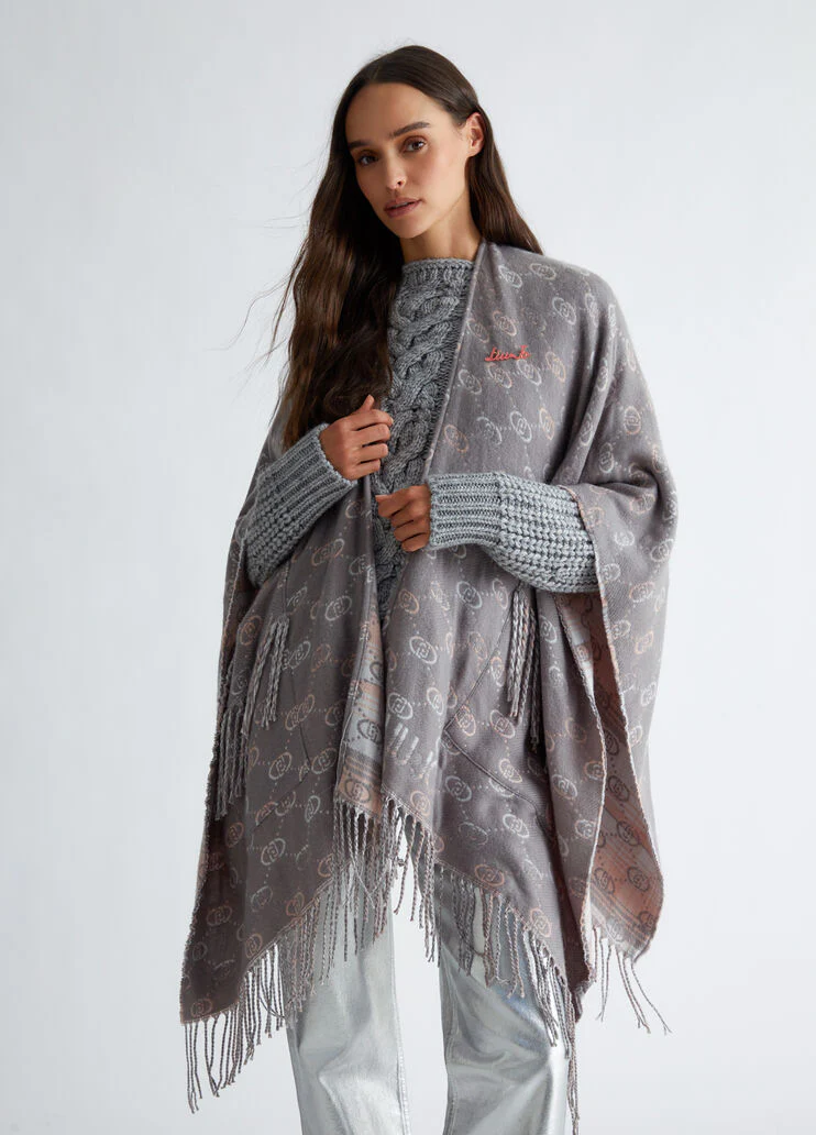 Poncho with jacquard logo