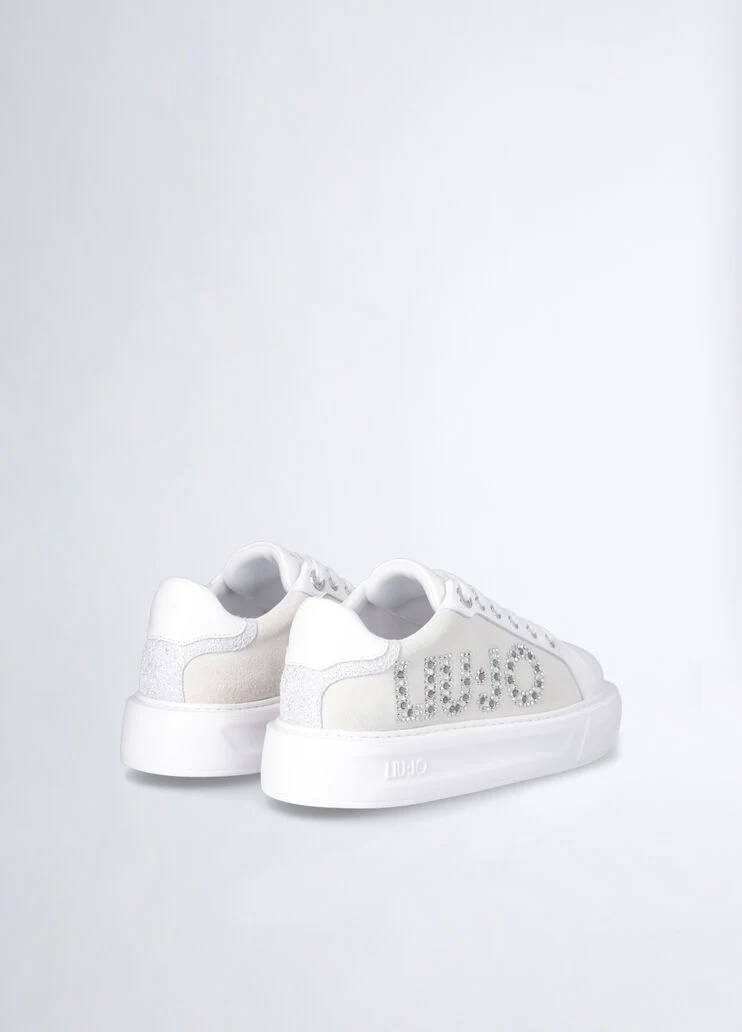White sneakers with bejewelled logo