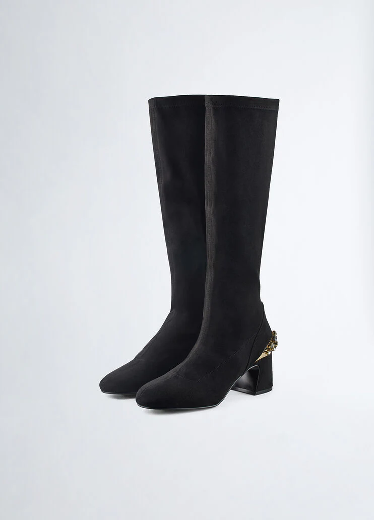 Knee-high boots with bejewelled gemstones