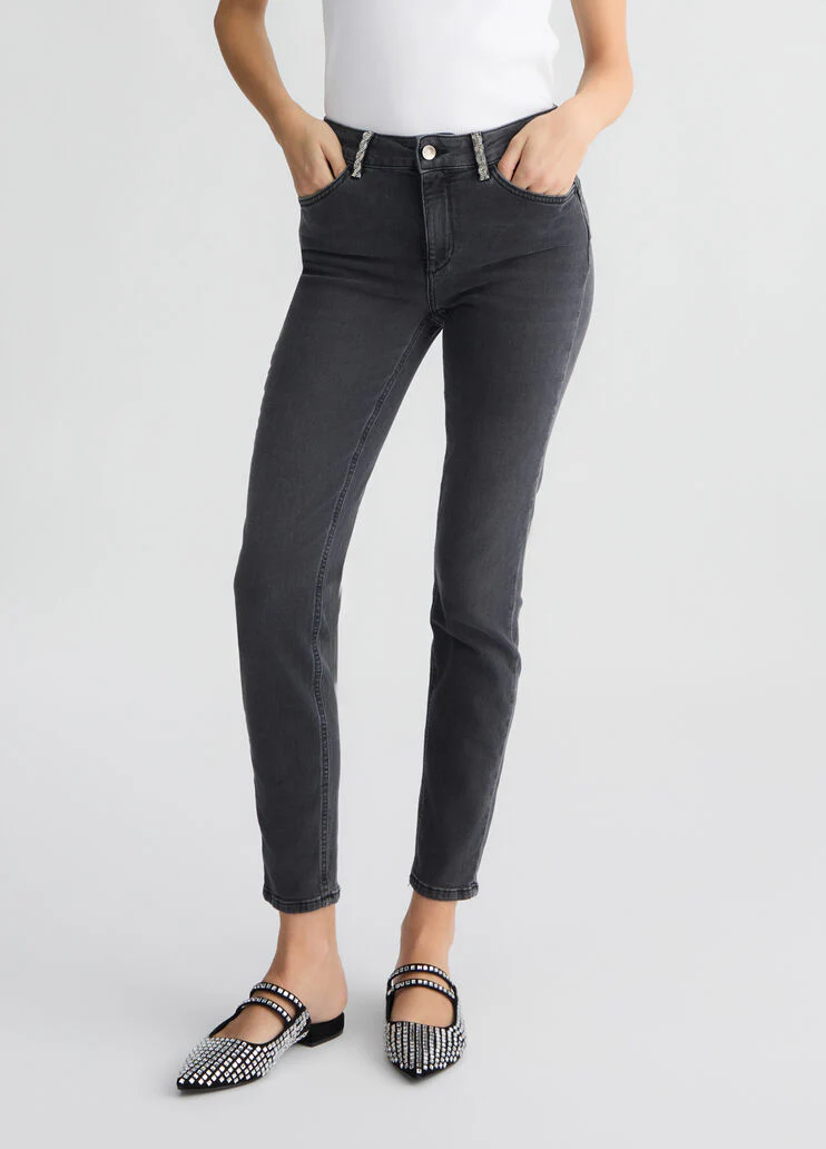 Grey skinny jeans with rhinestones