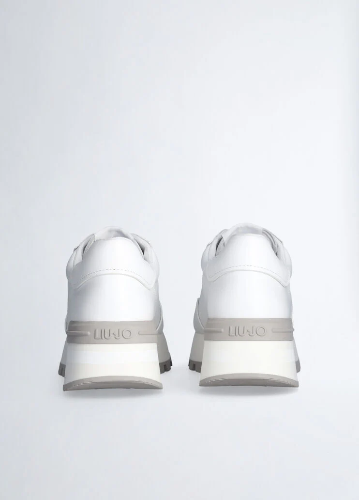 Leather sneakers with openwork logo