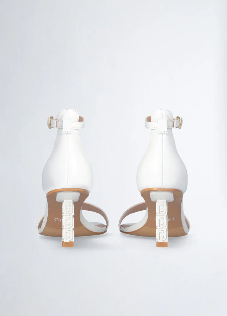 Sandals with branded heel