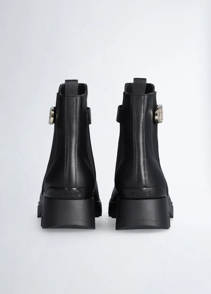 Black leather ankle boots with logo