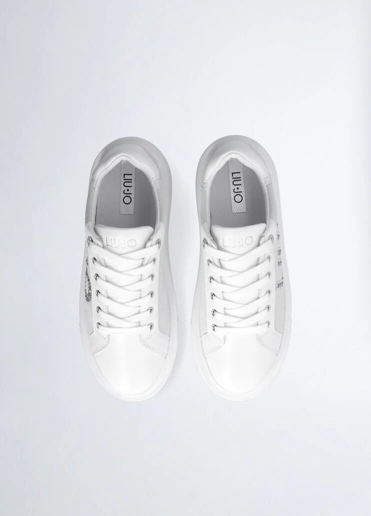 White sneakers with bejewelled logo