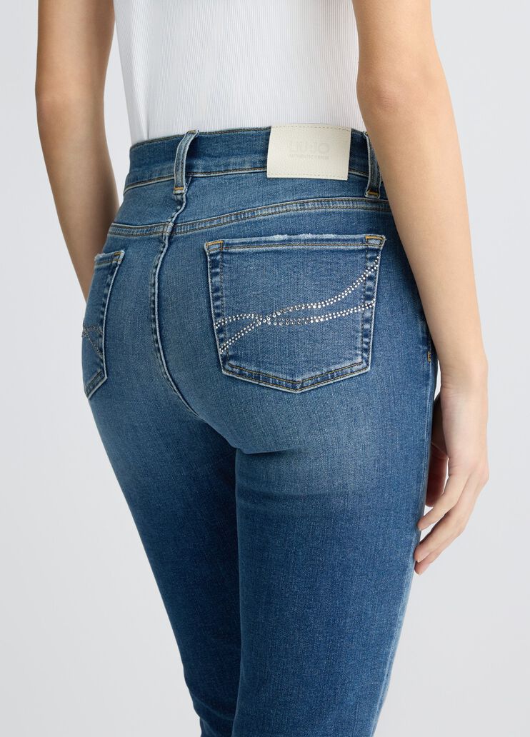 Blue bell-bottom jeans with rhinestones