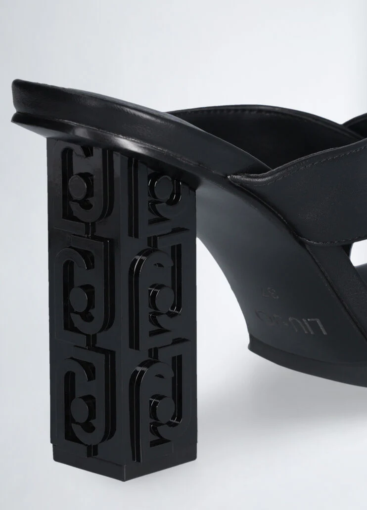 Sandals with branded heel