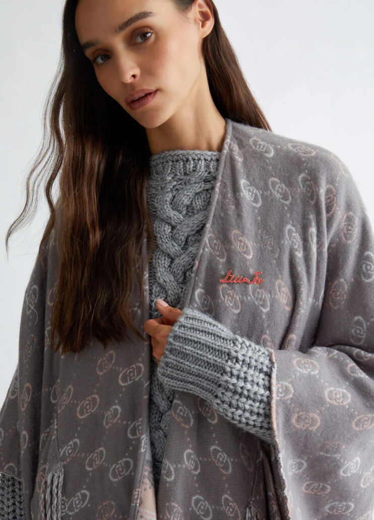 Poncho with jacquard logo