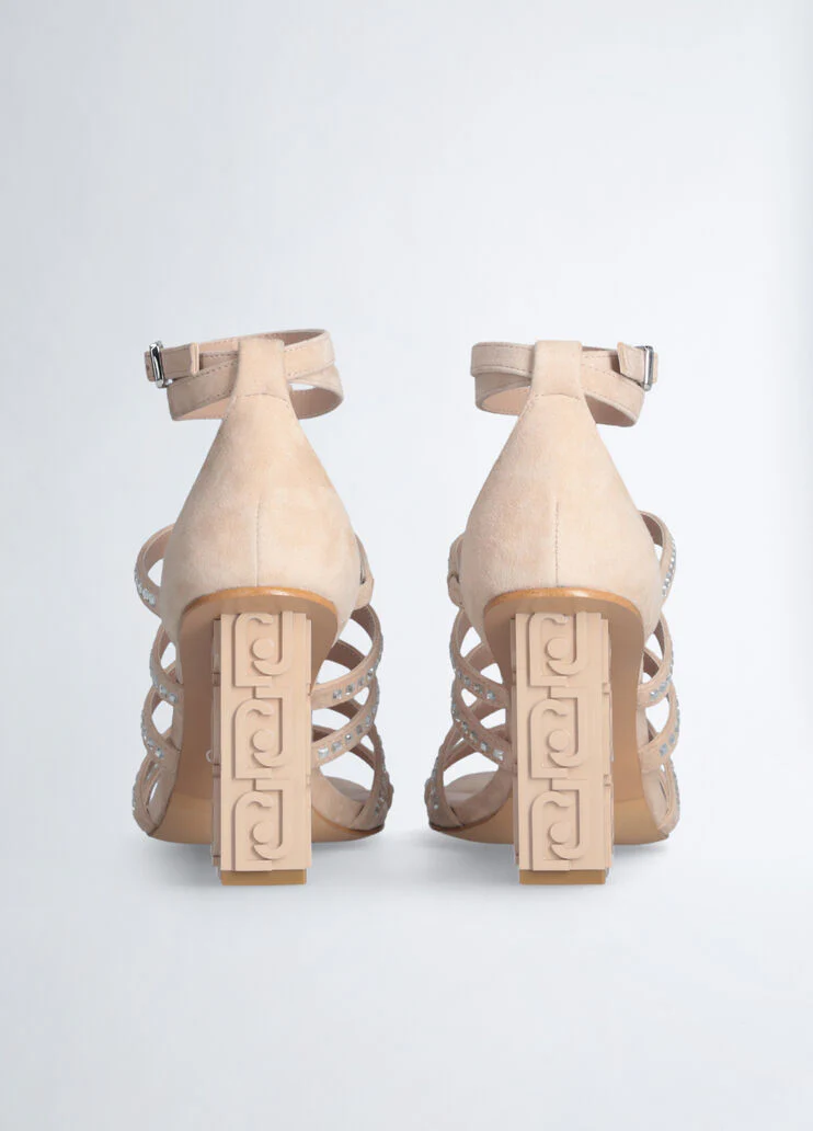 Sandals with branded heel
