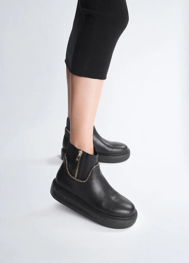 Black leather ankle boots with rhinestones