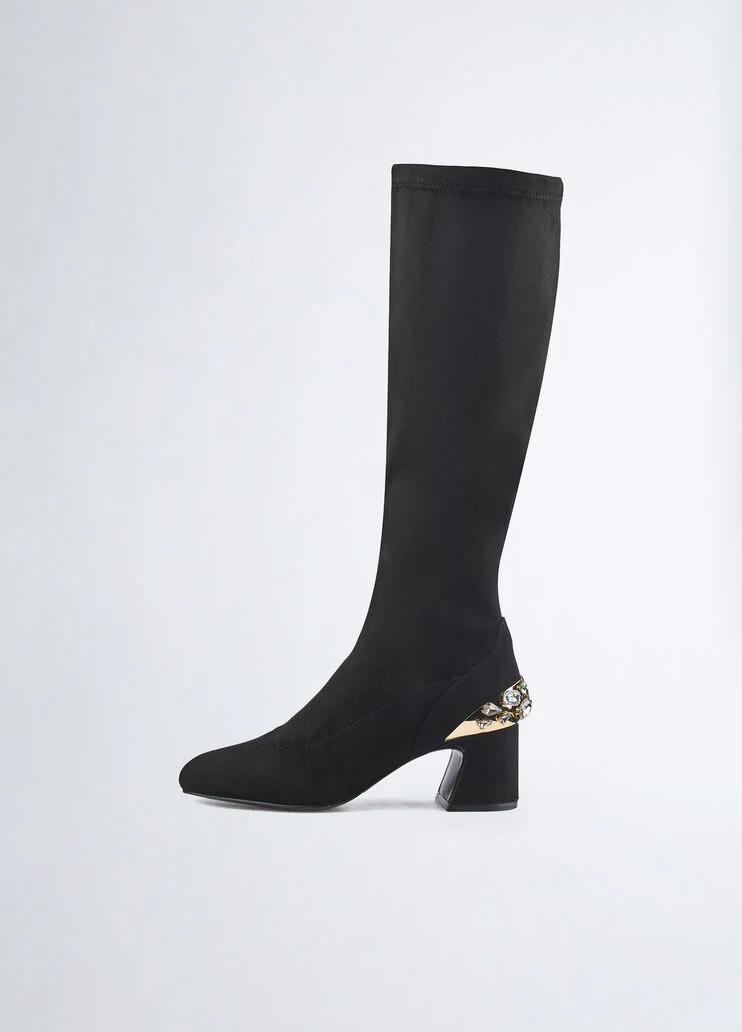 Knee-high boots with bejewelled gemstones