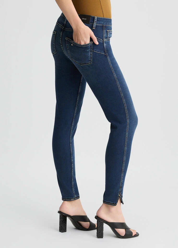 Dark blue skinny jeans with slit