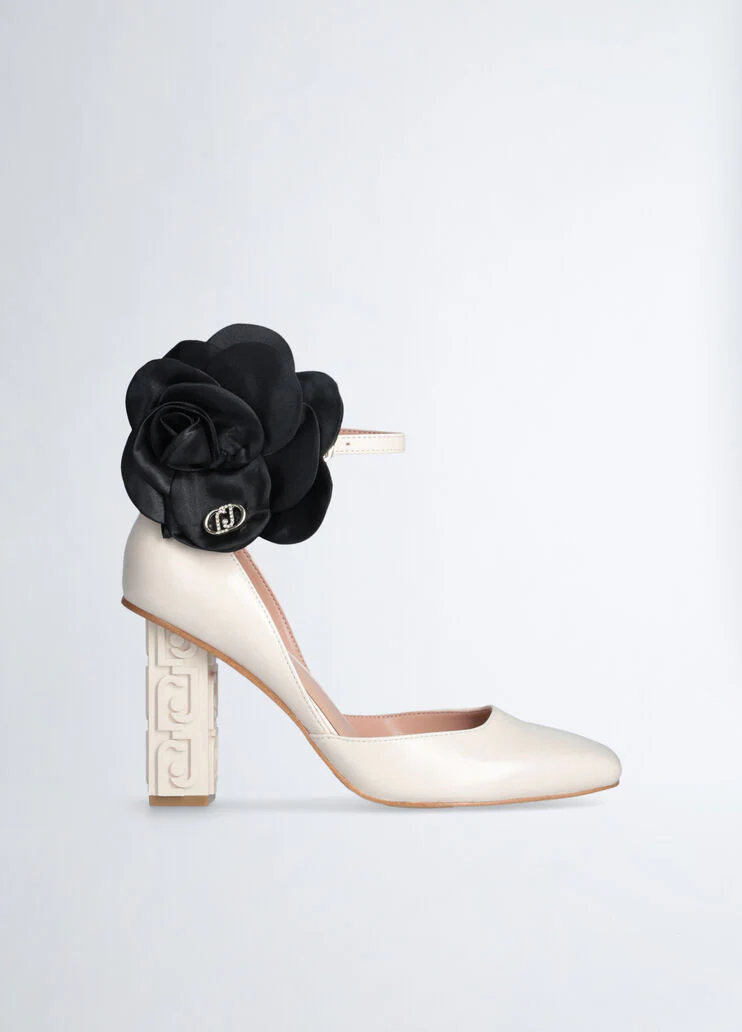White court shoes with flower detail