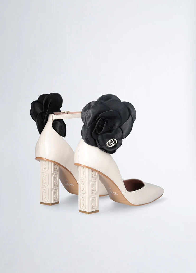 White court shoes with flower detail