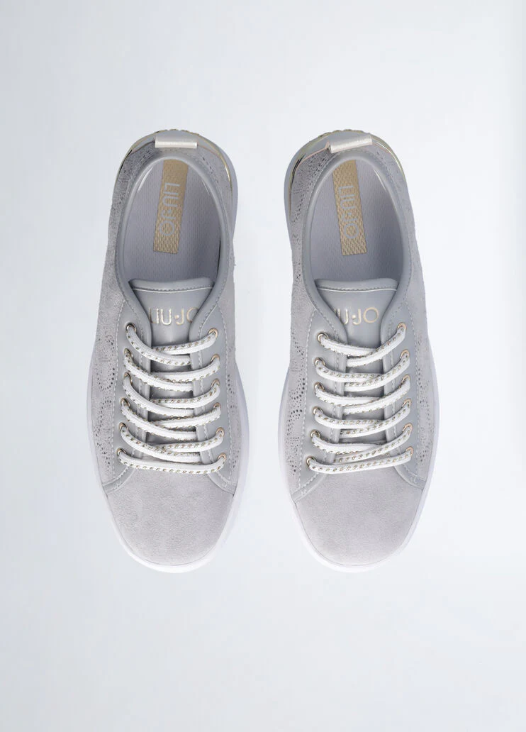 Sneakers with perforated weave