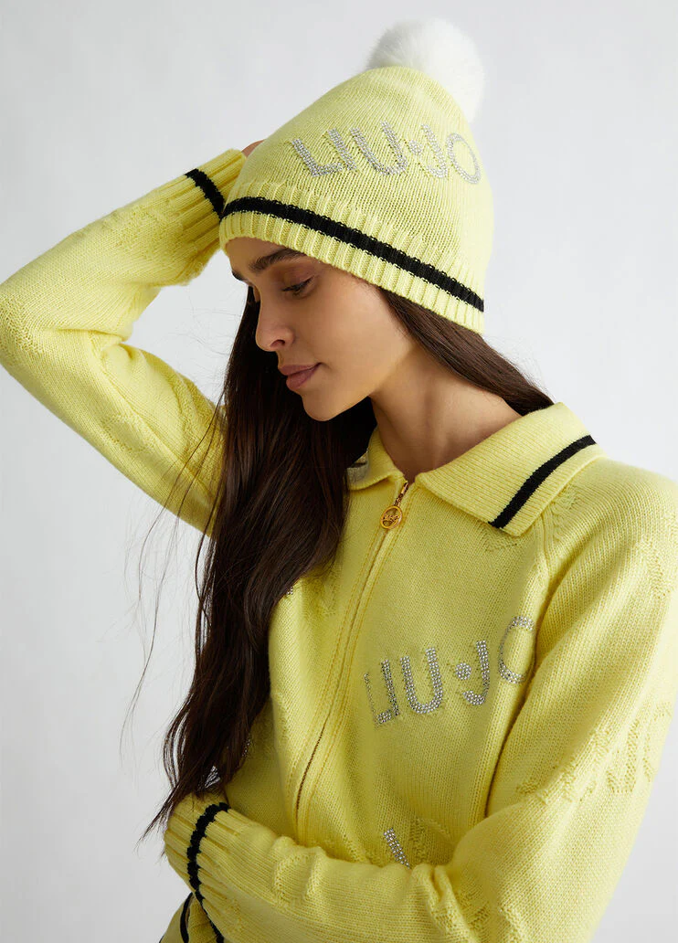 Yellow hat with pom-pom