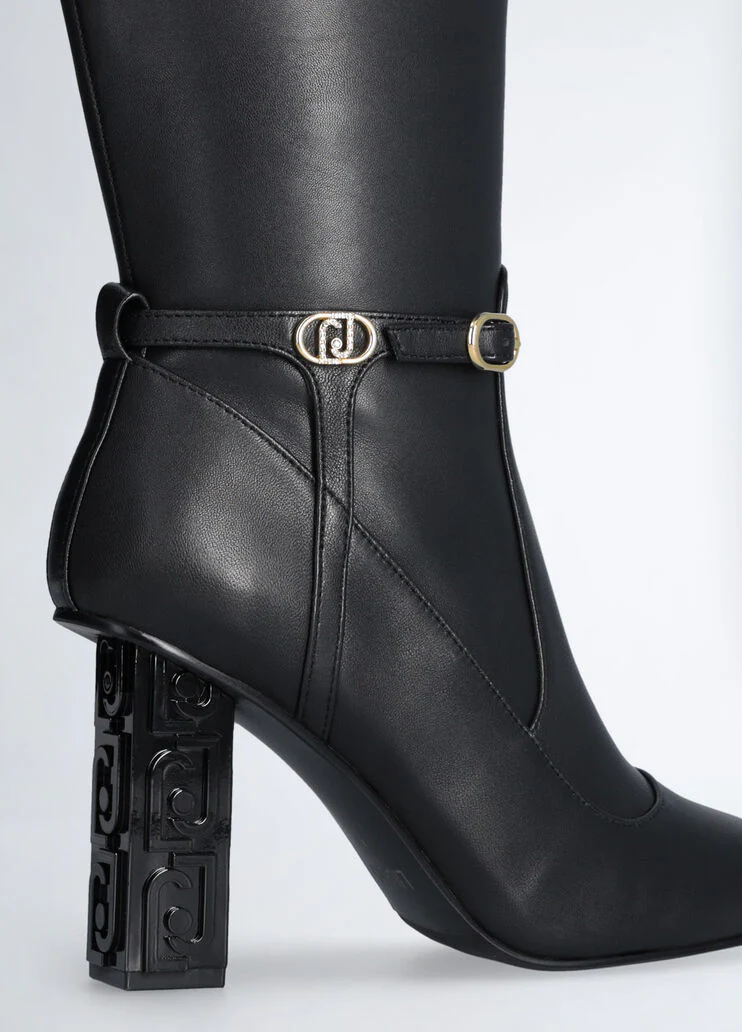 Black boots with branded heel