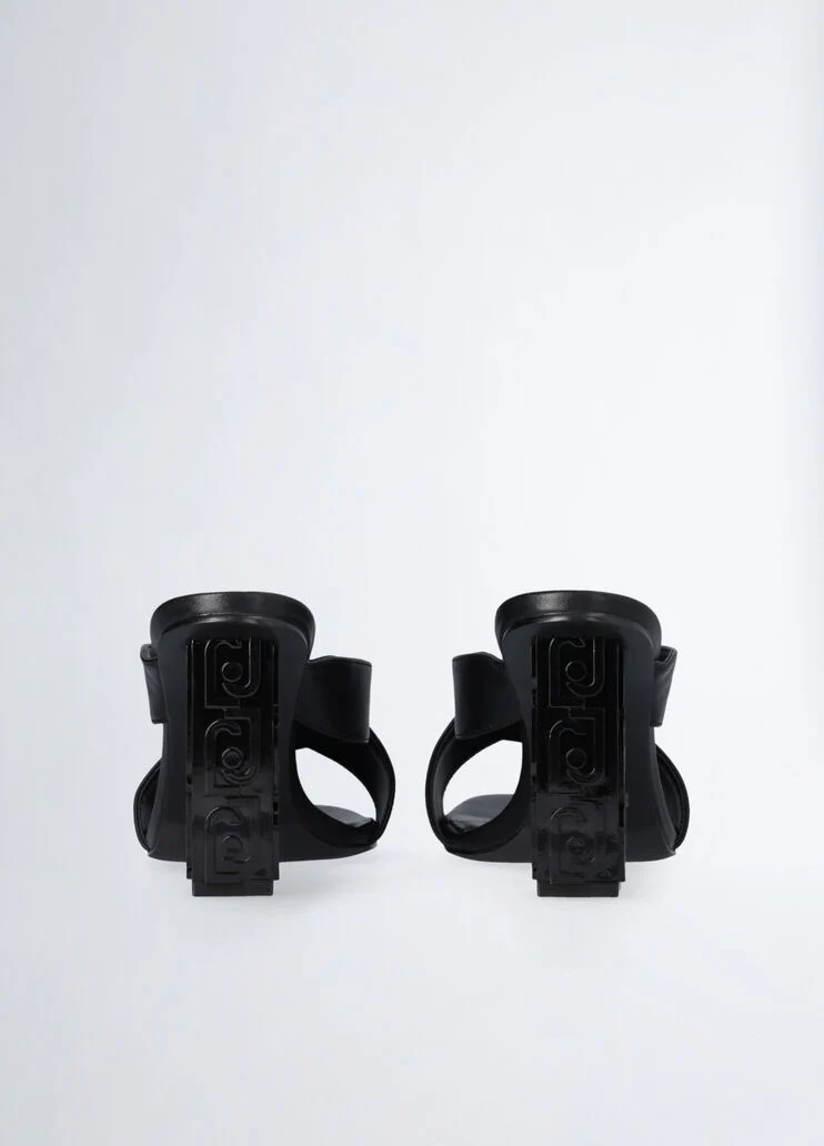 Sandals with branded heel