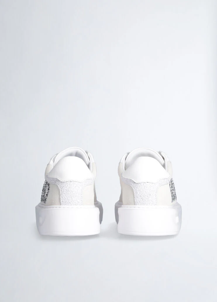 White sneakers with bejewelled logo