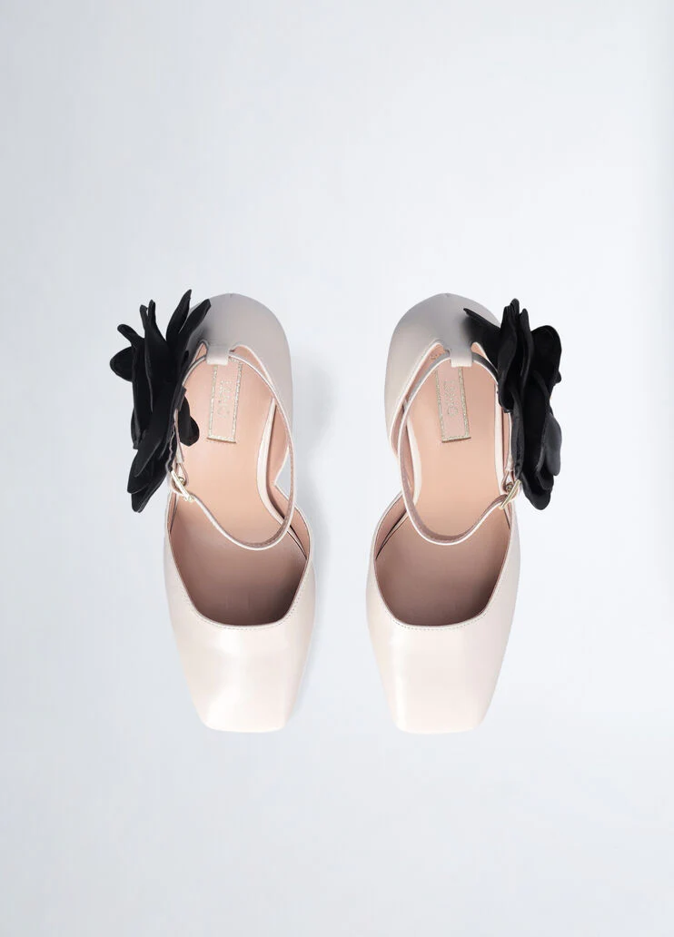 White court shoes with flower detail