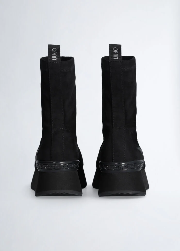 Black ankle boots with glittery star