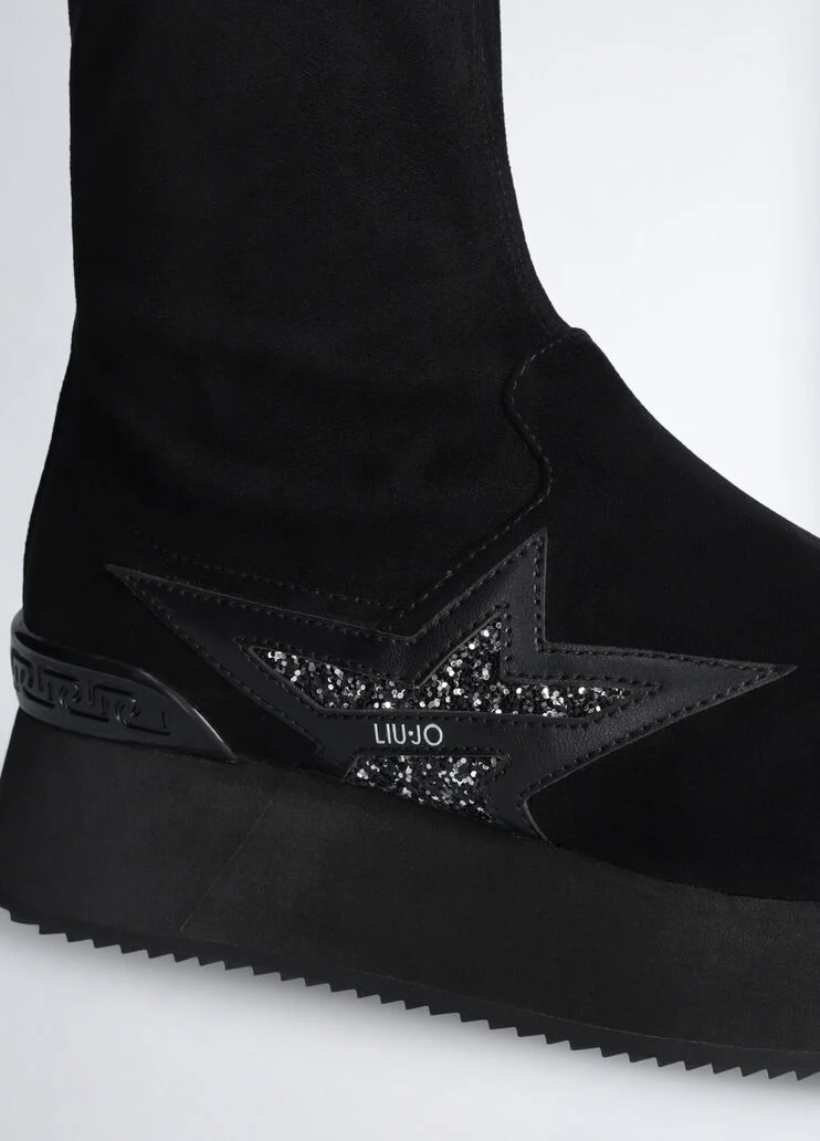 Black ankle boots with glittery star