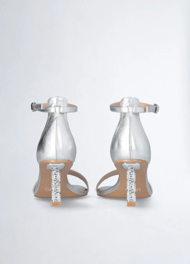 Sandals with branded heel