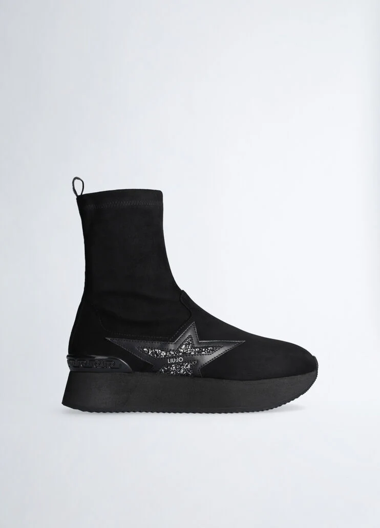 Black ankle boots with glittery star