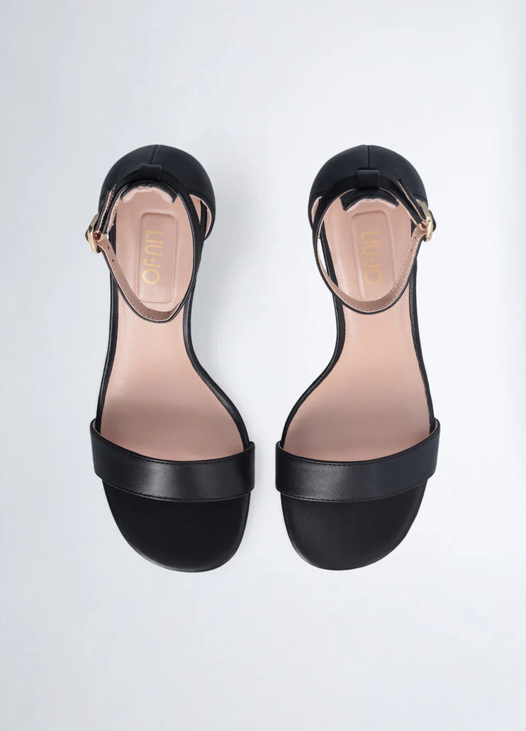 Sandals with branded heel