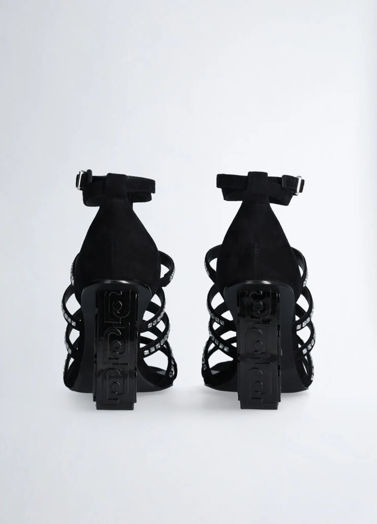 Sandals with branded heel