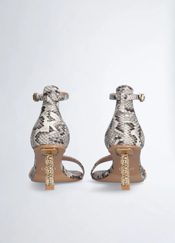 Sandals with branded heel