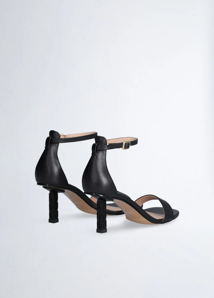 Sandals with branded heel