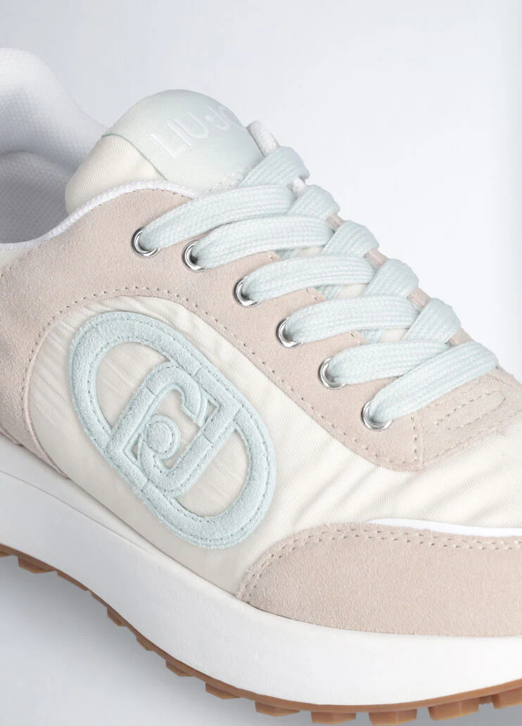 Beige sneakers with light blue logo